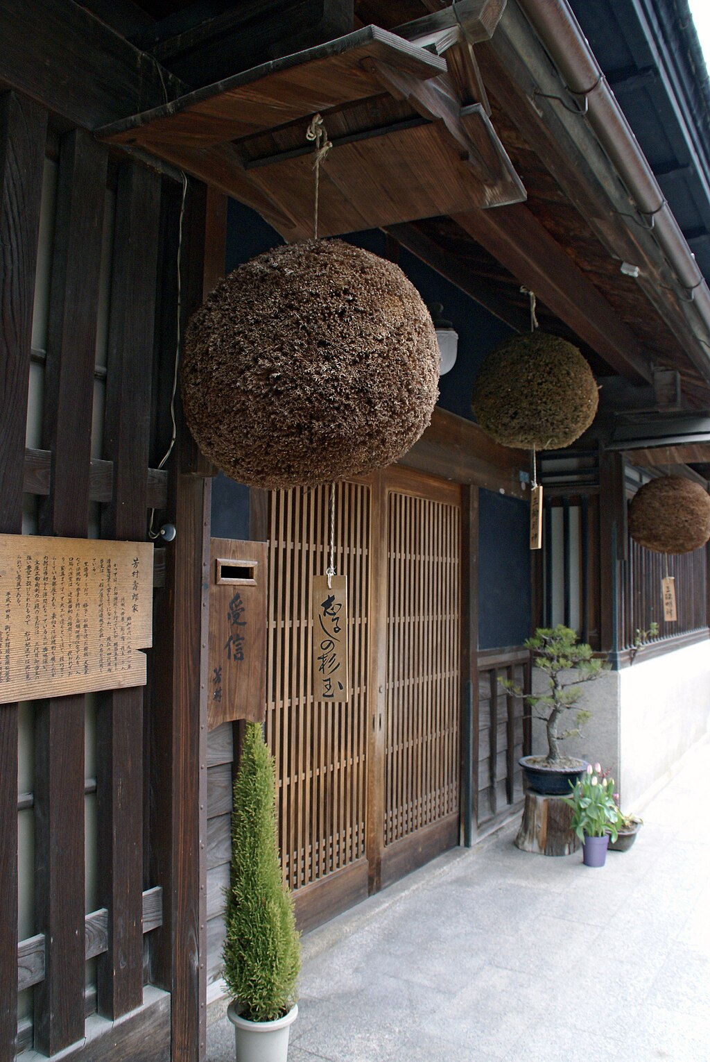 A sugitama, cedar leaf globe, hung at a Japanese sake brewery entrance