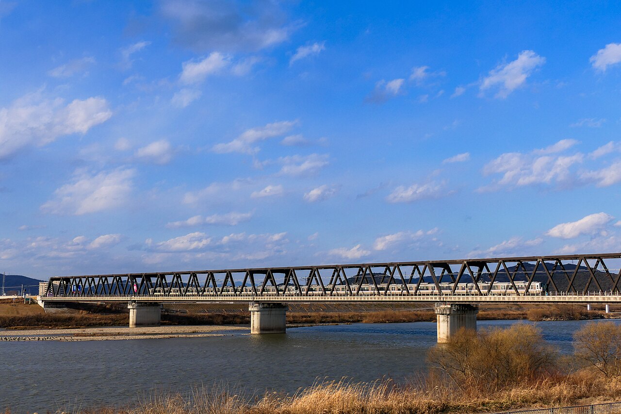 The Kako River and a railway bridge in Hyogo, the soft-water basin behind Banshu-ori yarn-dyeing