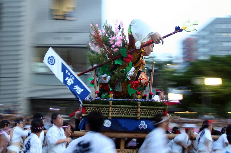Hakata Gion Yamakasa festival float being carried through Fukuoka