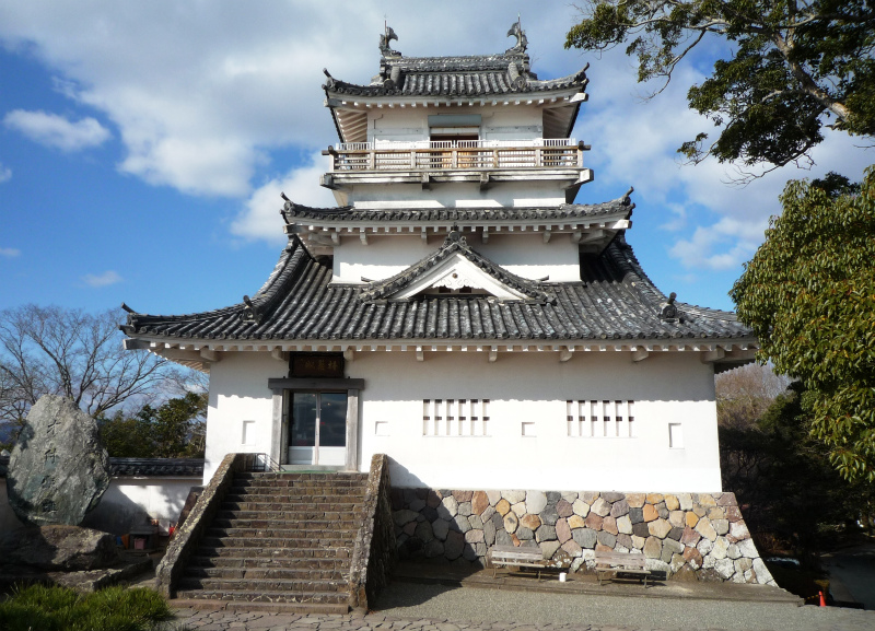 The small reconstructed keep of Kitsuki Castle on its hilltop in Oita