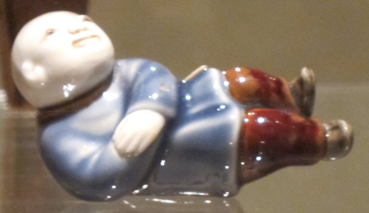 Hirado (Mikawachi) porcelain figure of a reclining Chinese boy, Honolulu Museum of Art