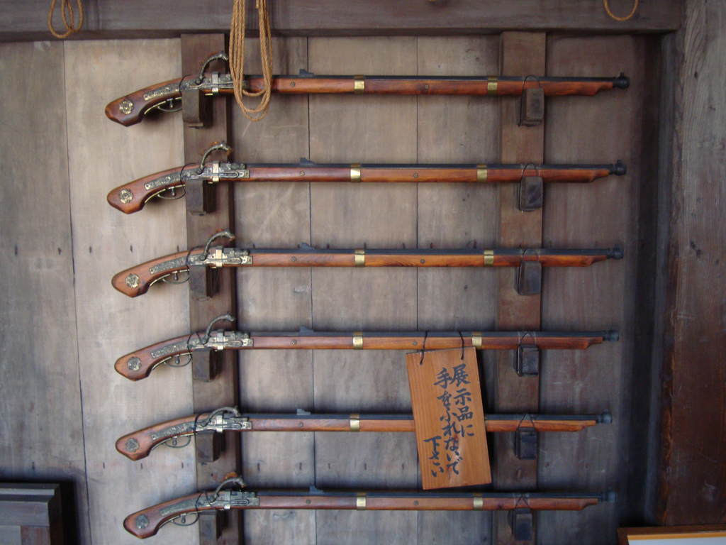 A rack of antique Japanese tanegashima matchlock guns of the type forged at Kunitomo