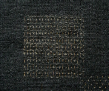 Yuki tsumugi kasuri kikkō (tortoiseshell) pattern detail in hand-spun silk