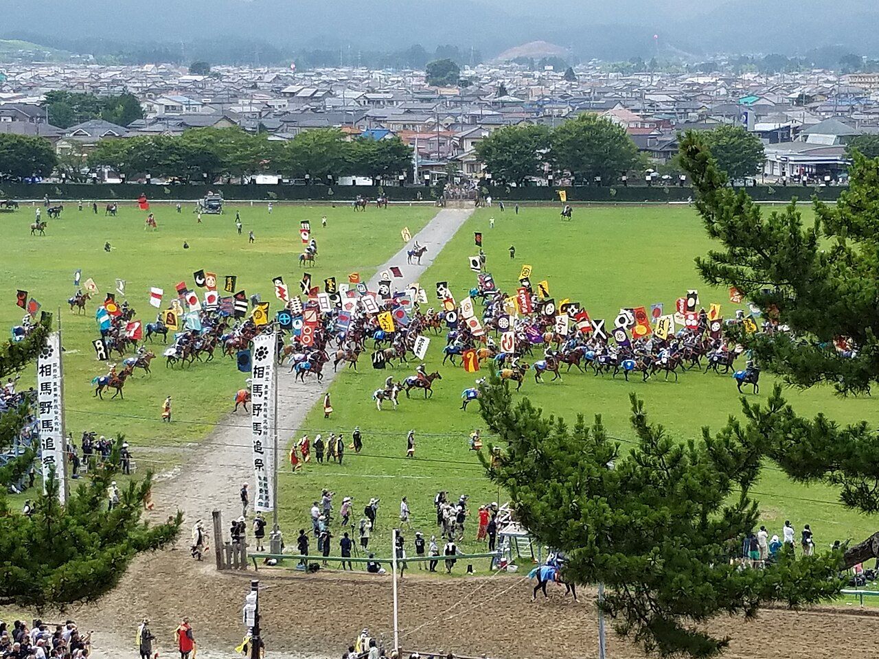 Armored riders galloping at the Soma Nomaoi cavalry festival in Fukushima