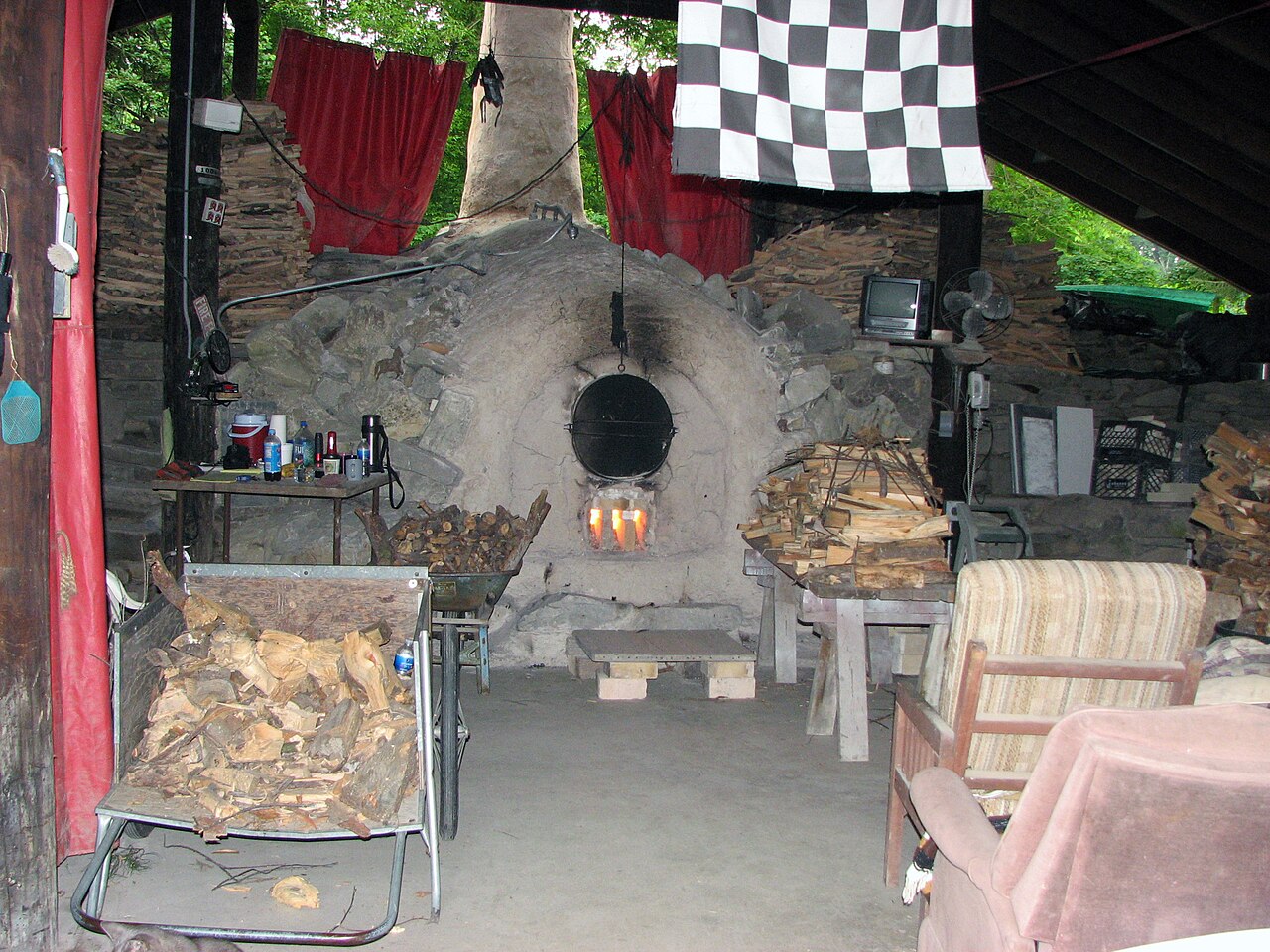 A wood-fired climbing kiln chamber packed for firing