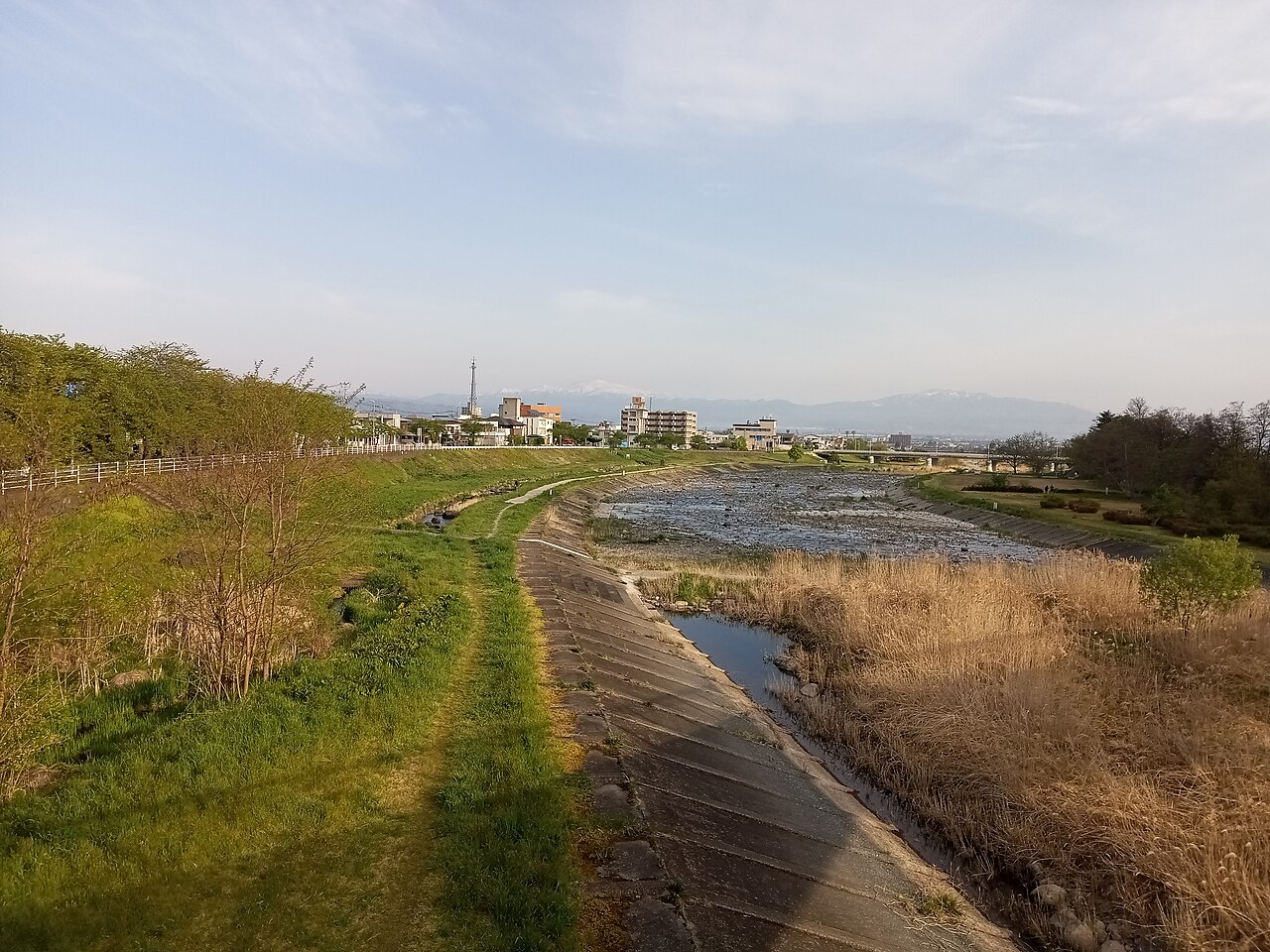 The Mamigasaki River flowing through Yamagata beneath the surrounding mountains